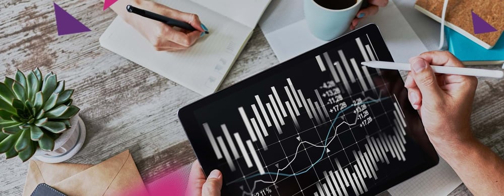 Tablet showing stats and figures on a busy desk (opens in new window)